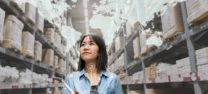 Portrait of happy young attractive asian entrepreneur woman looking at inventory in warehouse using smart tablet in management technology, interconnected industry, asian small business sme concept.