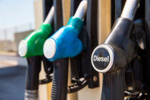 A close up of a gas pump with three fuel options, the closest option reads "Diesel"